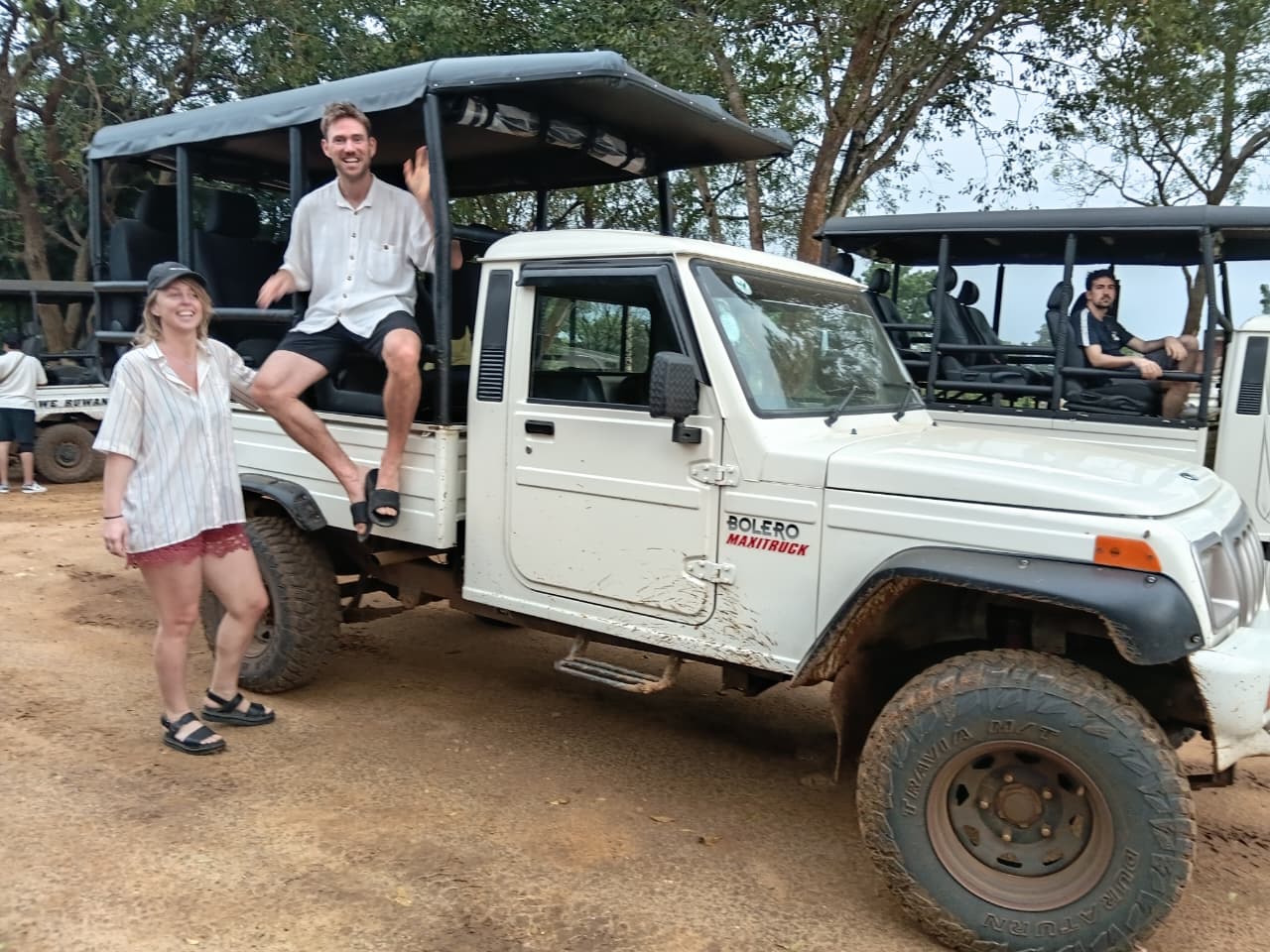 Travellers beside the safari truck before departure